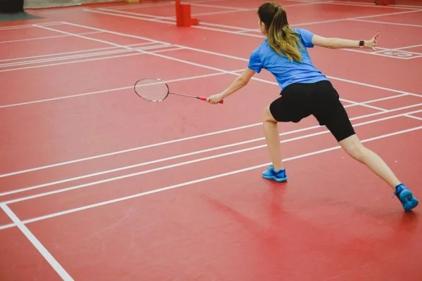 female badminton player in action